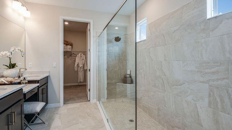 621 Se Ranch Palm City, FL 34990 - Photo 19 of 33 a bathroom with a granite countertop shower a sink and a mirror