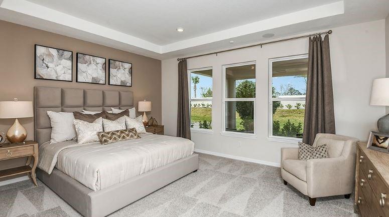 621 Se Ranch Palm City, FL 34990 - Photo 20 of 33 a bedroom with a large bed and a large window
