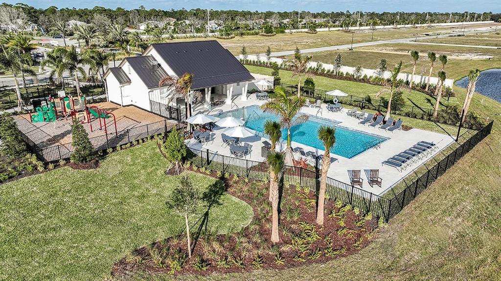 621 Se Ranch Palm City, FL 34990 - Photo 23 of 33 an aerial view of a house with a lake view