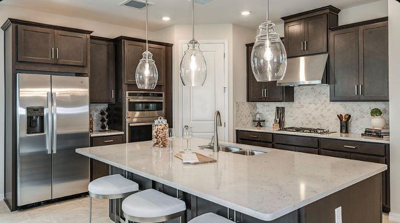 621 Se Ranch Palm City, FL 34990 - Photo 6 of 33 a kitchen with stainless steel appliances granite countertop a sink refrigerator and microwave