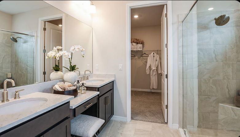621 Se Ranch Palm City, FL 34990 - Photo 8 of 33 a bathroom with a granite countertop sink a toilet and shower