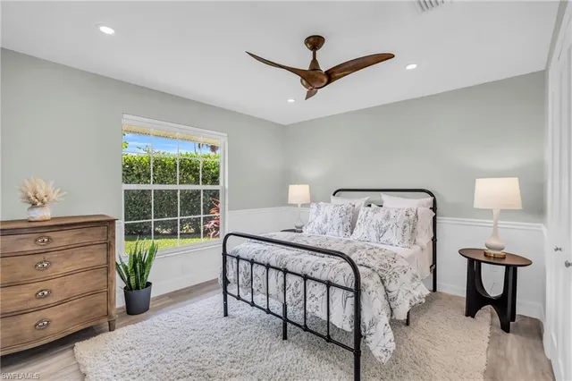 a bedroom with a bed and a table in it