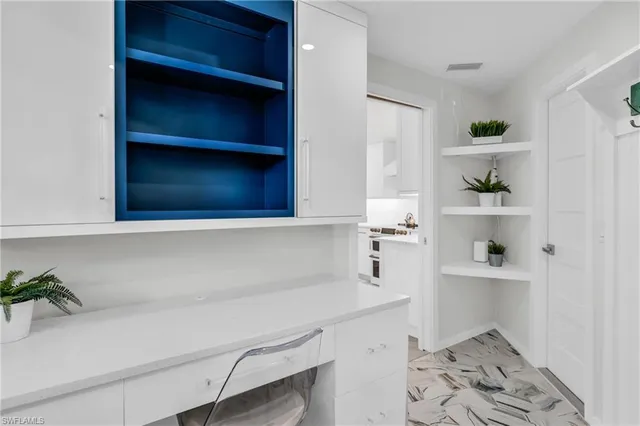 a hallway with cabinets