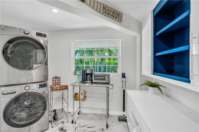 a view of a bedroom with washer and dryer