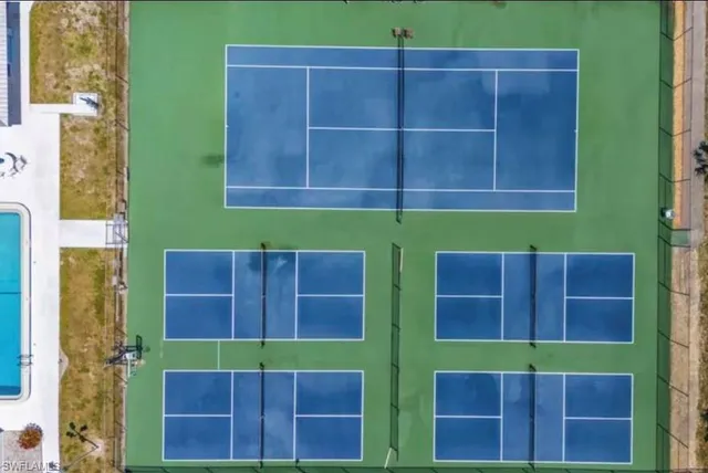 a view of front door and wooden fence
