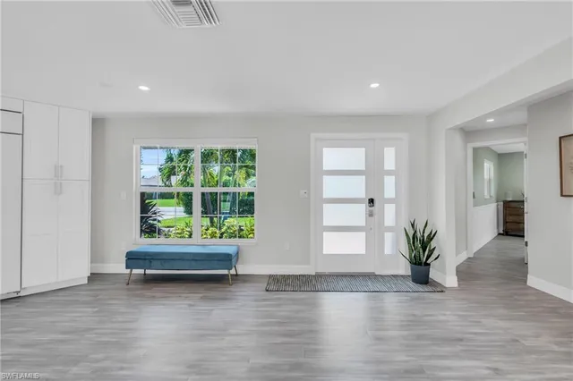 a view of room with window and wooden floor