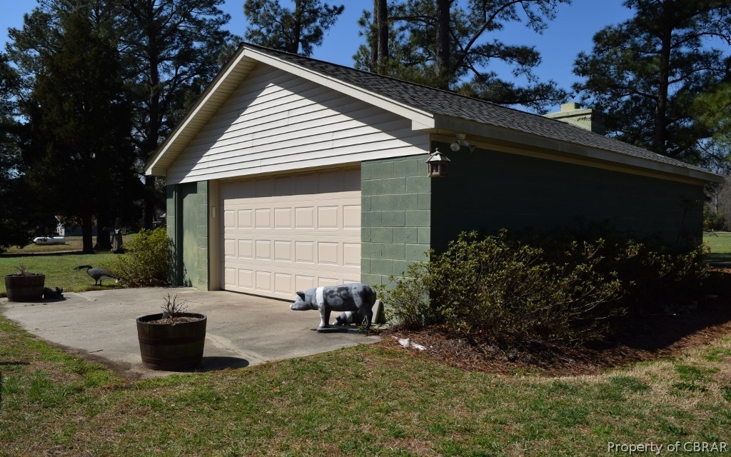 4288 Cedar Bush Road Hayes, VA 23072 - Photo 39 of 48 Large detached garage with electricity and automatic garage door opener.