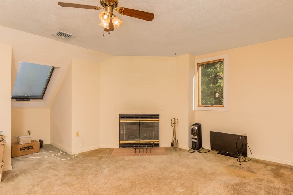 14 Deer Path, Unit 6 Maynard, MA 01754 - Photo 11 of 20 a view of an empty room with a fireplace