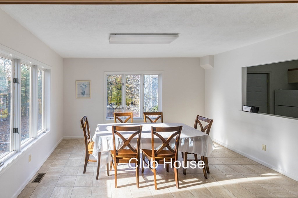 14 Deer Path, Unit 6 Maynard, MA 01754 - Photo 18 of 20 a view of a dining room with furniture and wooden floor