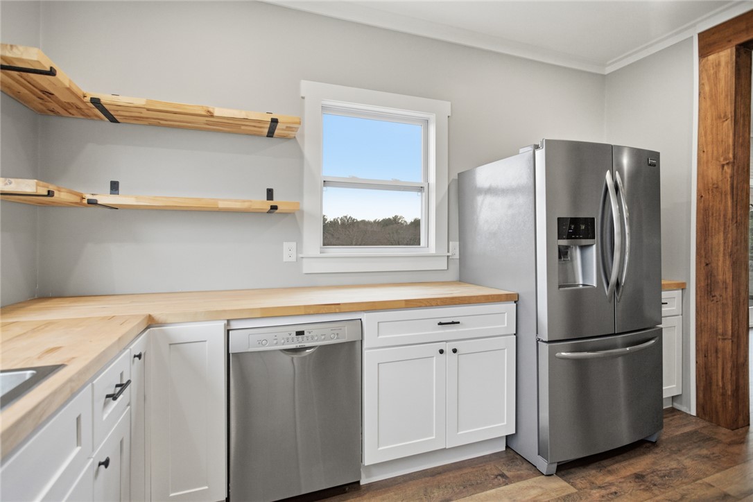 118 Grogan Road Westminster, SC 29693 - Photo 12 of 50 Butcher block countertops and open wood shelving create a warm, inviting space.