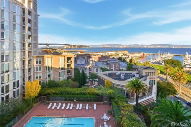 a bathroom with a granite countertop sink a mirror and a shower