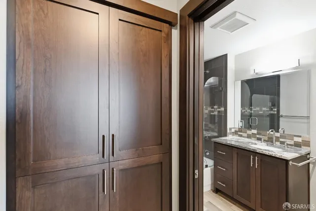 a view of a kitchen with a sink and a stove
