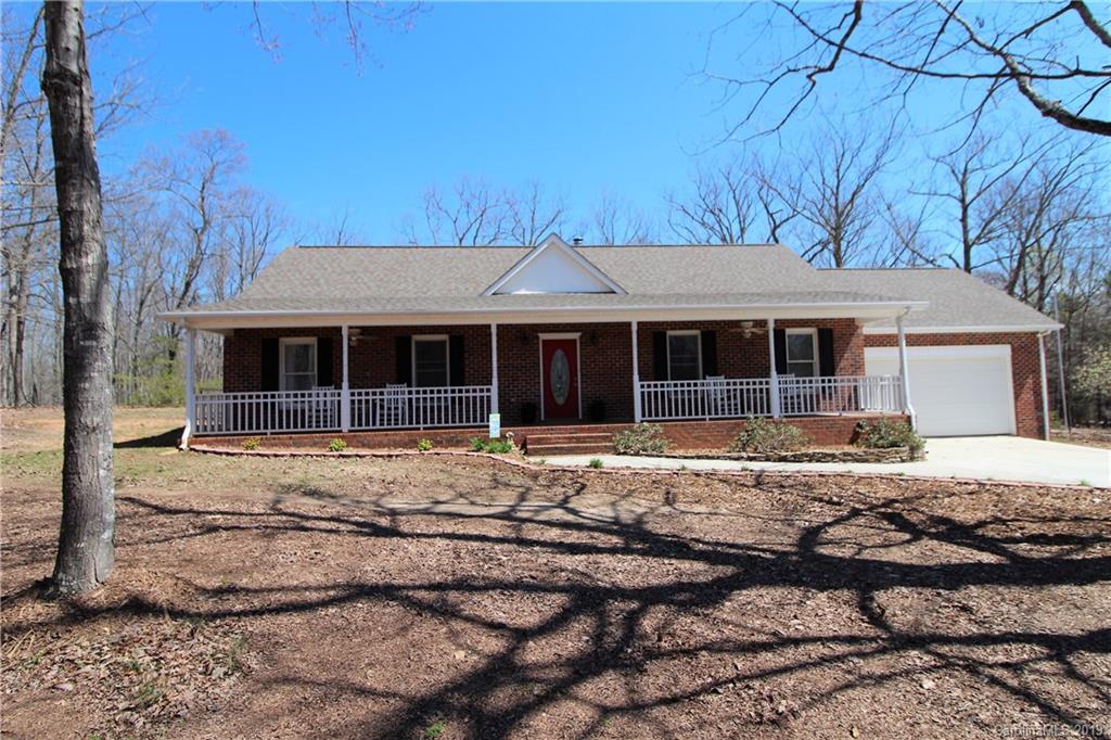 934 Beamguard Road Clover, SC 29710 - Photo 1 of 35 a front view of a house with a garden