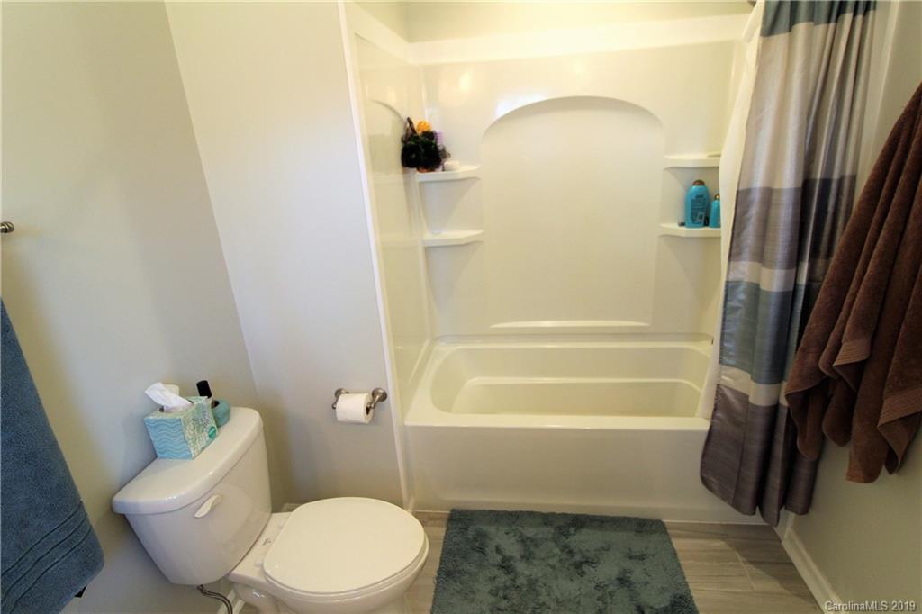 934 Beamguard Road Clover, SC 29710 - Photo 14 of 35 a bathroom with a toilet and a shower