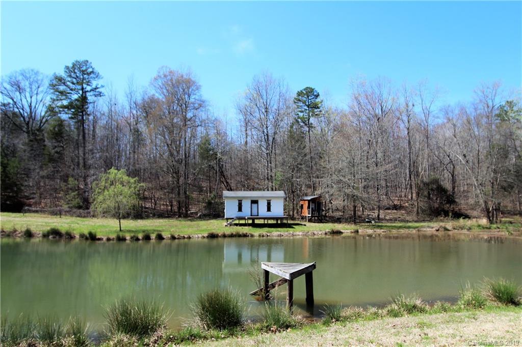 934 Beamguard Road Clover, SC 29710 - Photo 34 of 35 a view of a lake with a house in the background