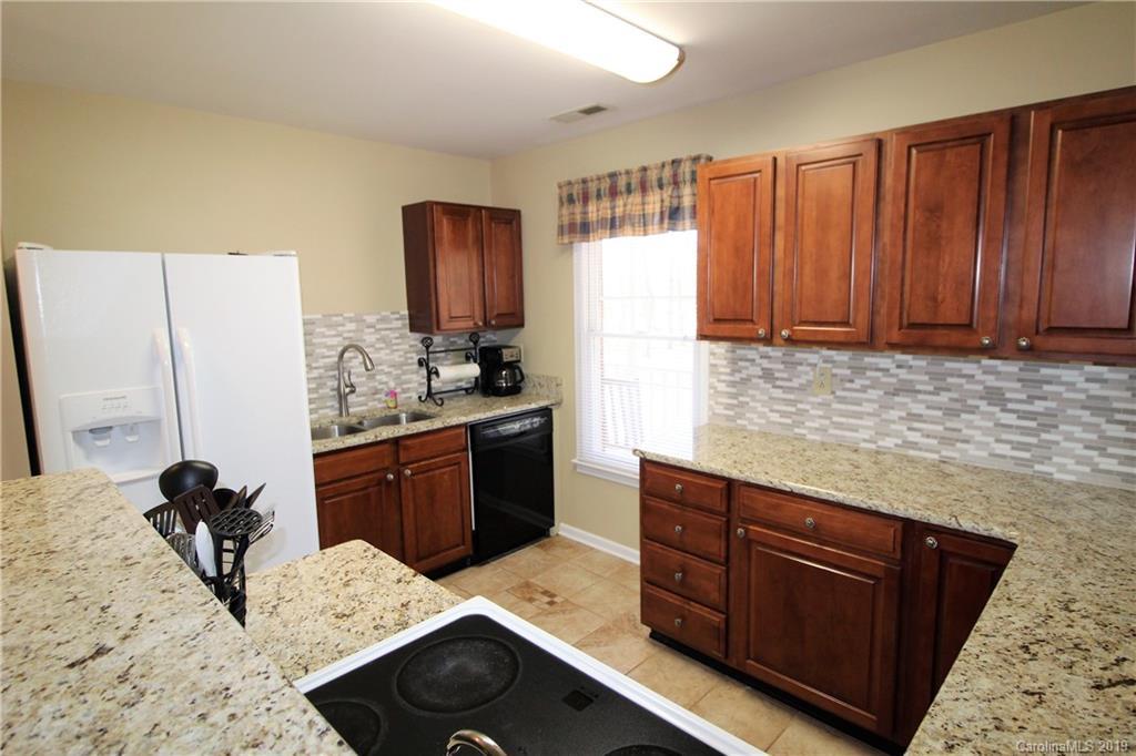 934 Beamguard Road Clover, SC 29710 - Photo 6 of 35 a kitchen with a refrigerator and a stove