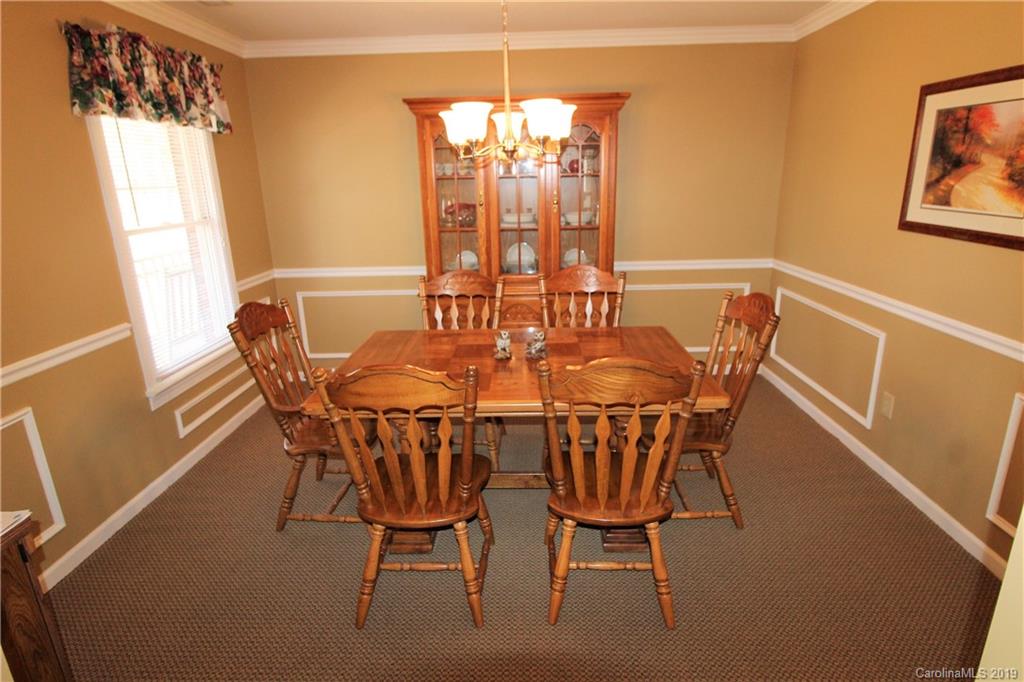 934 Beamguard Road Clover, SC 29710 - Photo 9 of 35 a view of a dining room with furniture and chandelier