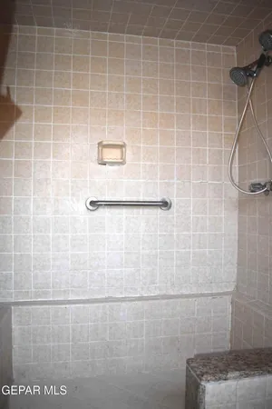 a view of backyard of a house with seating space