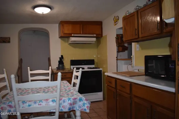 a bedroom with a bed and a television