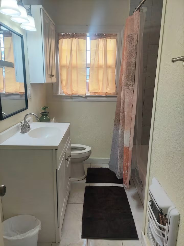 2824 5th Street Bay City, TX 77414 - Photo 16 of 17 a bathroom with a sink and a mirror