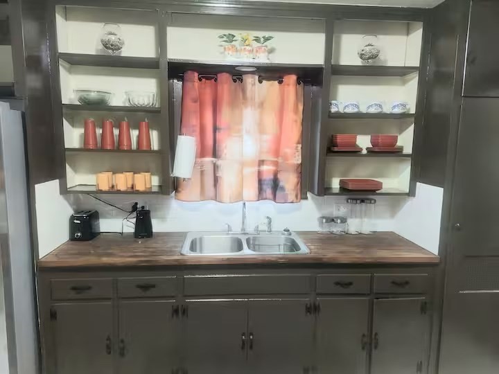 2824 5th Street Bay City, TX 77414 - Photo 4 of 17 a kitchen with a sink and a window