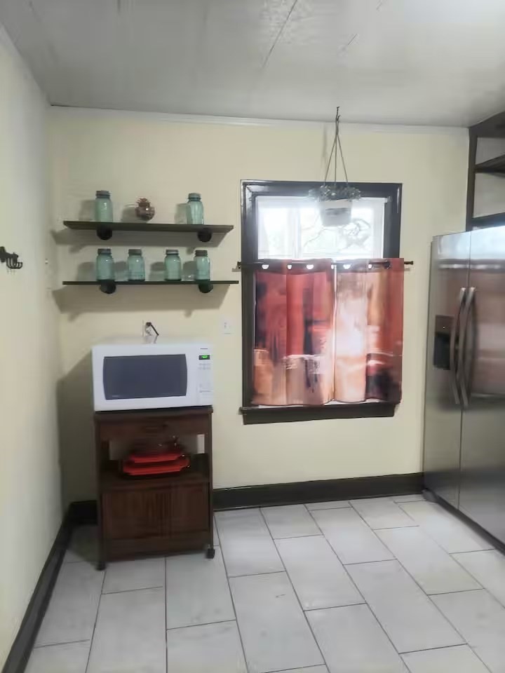 2824 5th Street Bay City, TX 77414 - Photo 5 of 17 a kitchen with a stove and a refrigerator