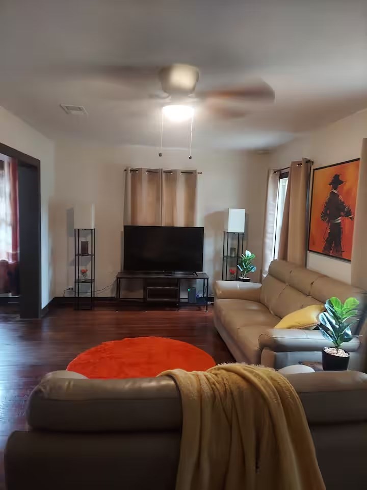2824 5th Street Bay City, TX 77414 - Photo 6 of 17 a living room with furniture a flat screen tv and a fireplace