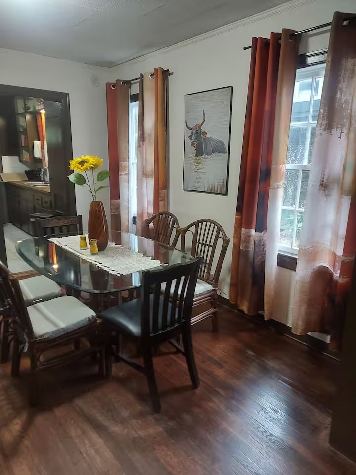 2824 5th Street Bay City, TX 77414 - Photo 7 of 17 a dining room with furniture a window and wooden floor