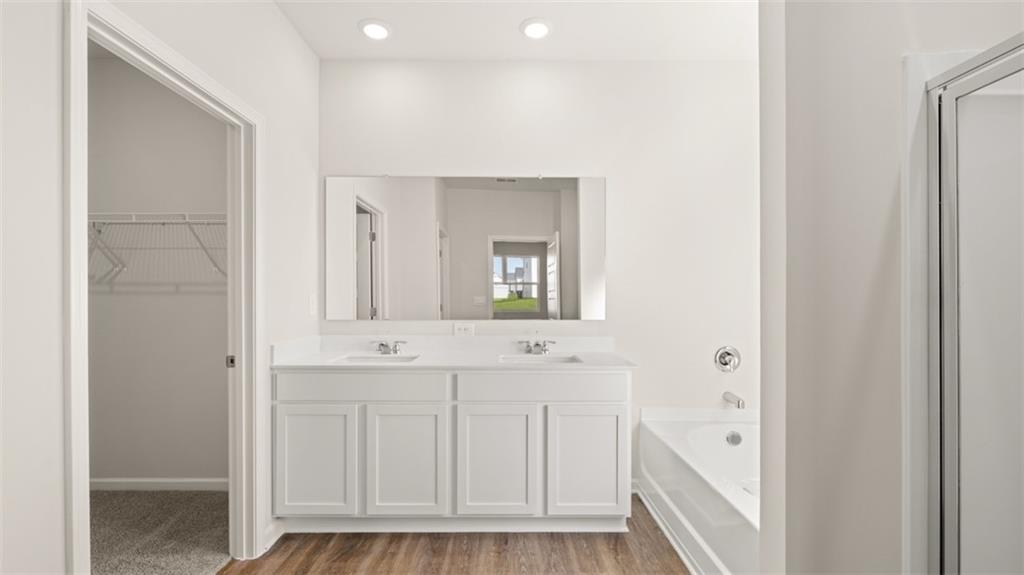 214 Cattle Drive Perry, GA 31069 - Photo 23 of 39 a bathroom with a sink and a mirror