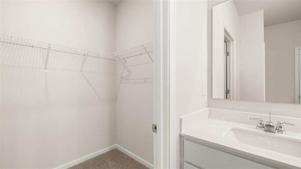 214 Cattle Drive Perry, GA 31069 - Photo 27 of 39 a bathroom with a sink and a mirror