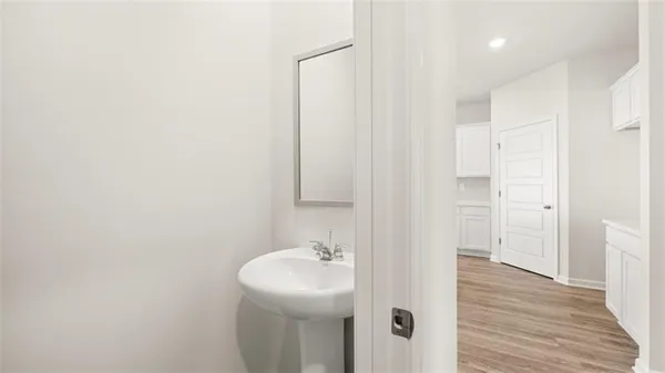 a bathroom with a sink and mirror