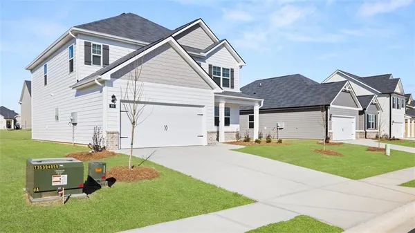 a front view of a house with a yard