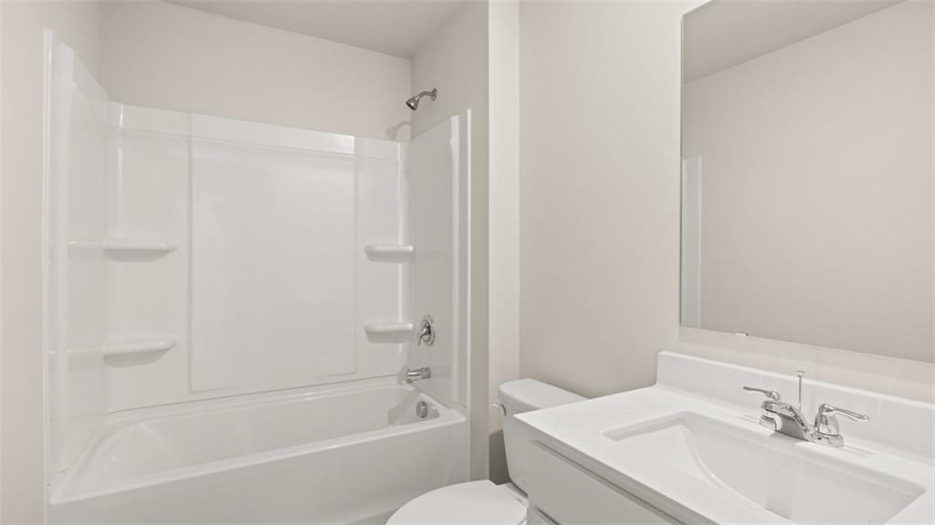 214 Cattle Drive Perry, GA 31069 - Photo 36 of 39 a bathroom with a sink toilet and bathtub