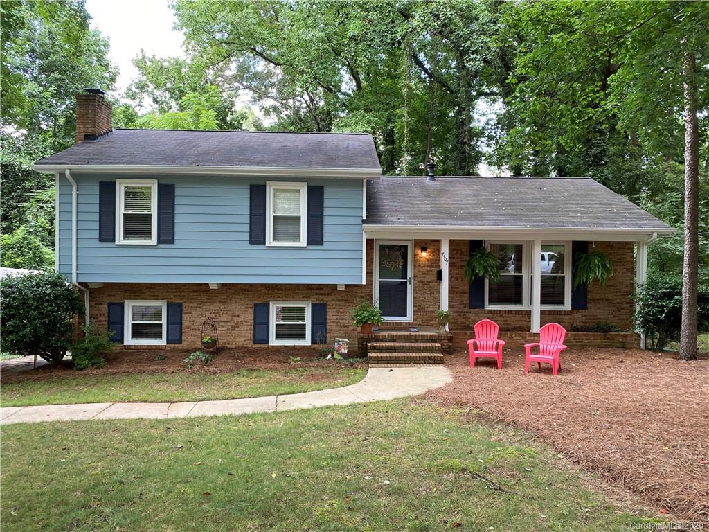 7407 Watercrest Road Charlotte, NC 28210 - Photo 1 of 42 a front view of a house with a yard