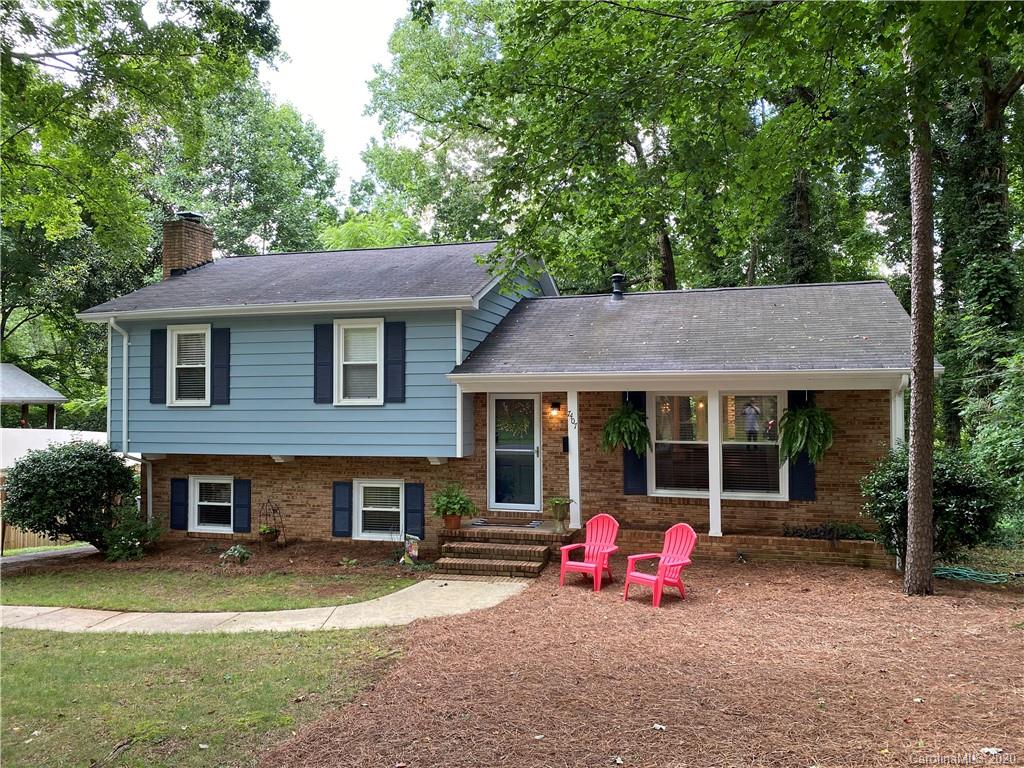 7407 Watercrest Road Charlotte, NC 28210 - Photo 2 of 42 a small garden covered with tall trees