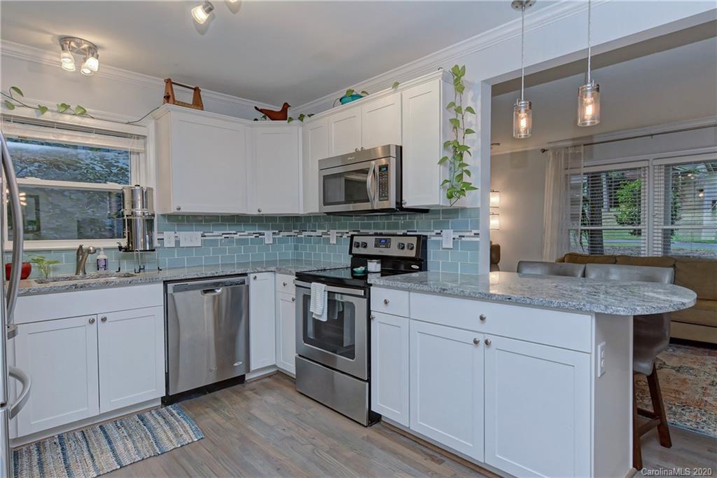 7407 Watercrest Road Charlotte, NC 28210 - Photo 11 of 42 a kitchen with stainless steel appliances granite countertop a sink and cabinets