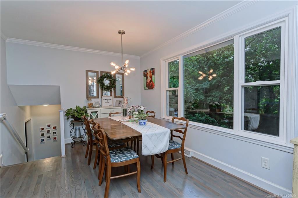 7407 Watercrest Road Charlotte, NC 28210 - Photo 15 of 42 a view of a dining room with furniture window and wooden floor