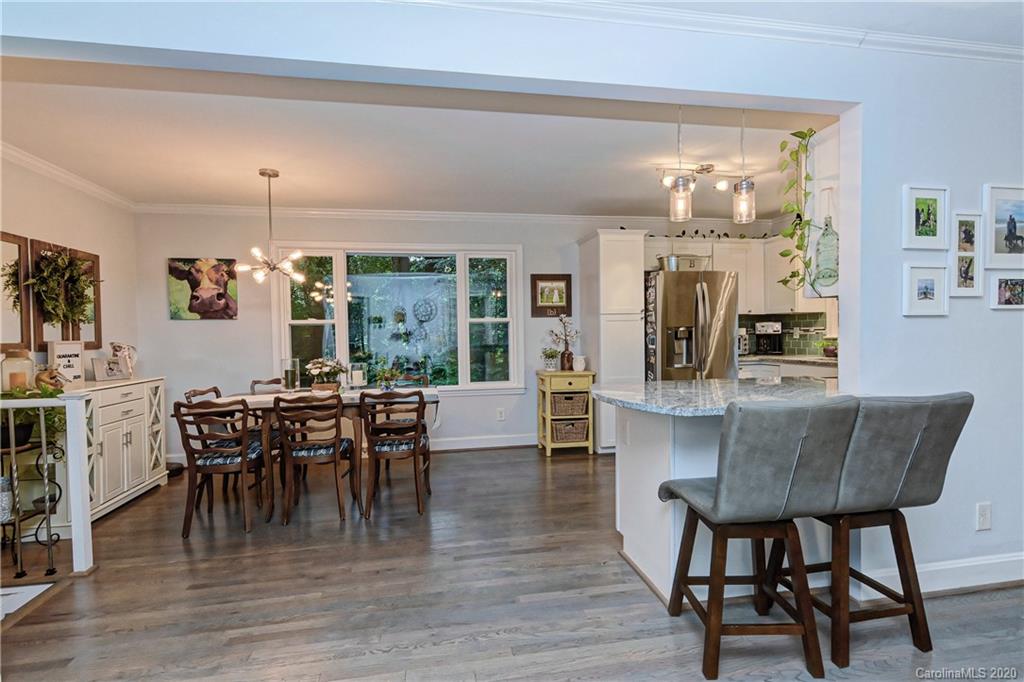 7407 Watercrest Road Charlotte, NC 28210 - Photo 3 of 42 a view of a dining room with furniture window and wooden floor