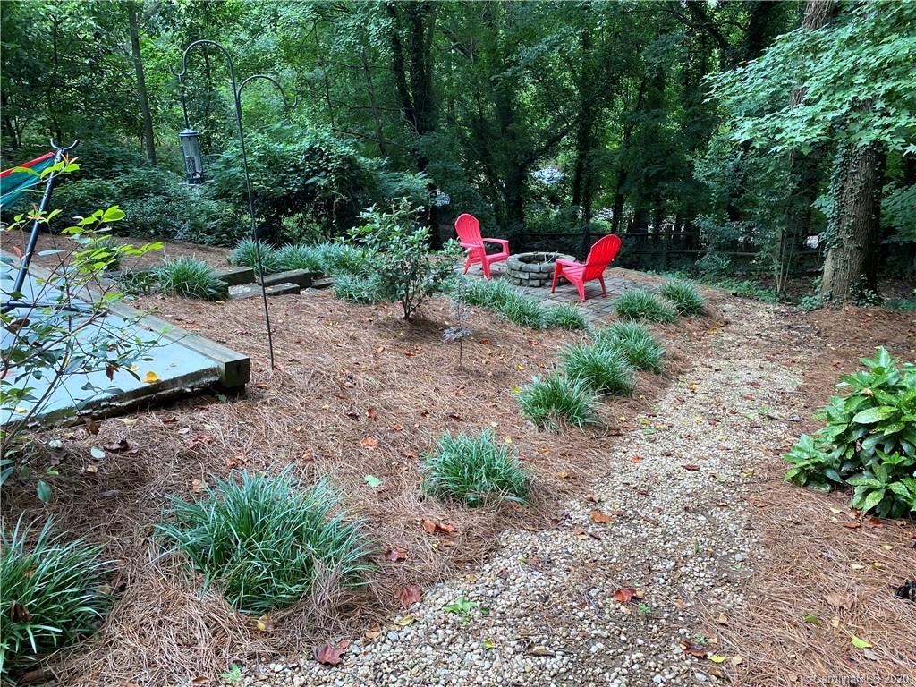 7407 Watercrest Road Charlotte, NC 28210 - Photo 36 of 42 a view of a backyard with large trees