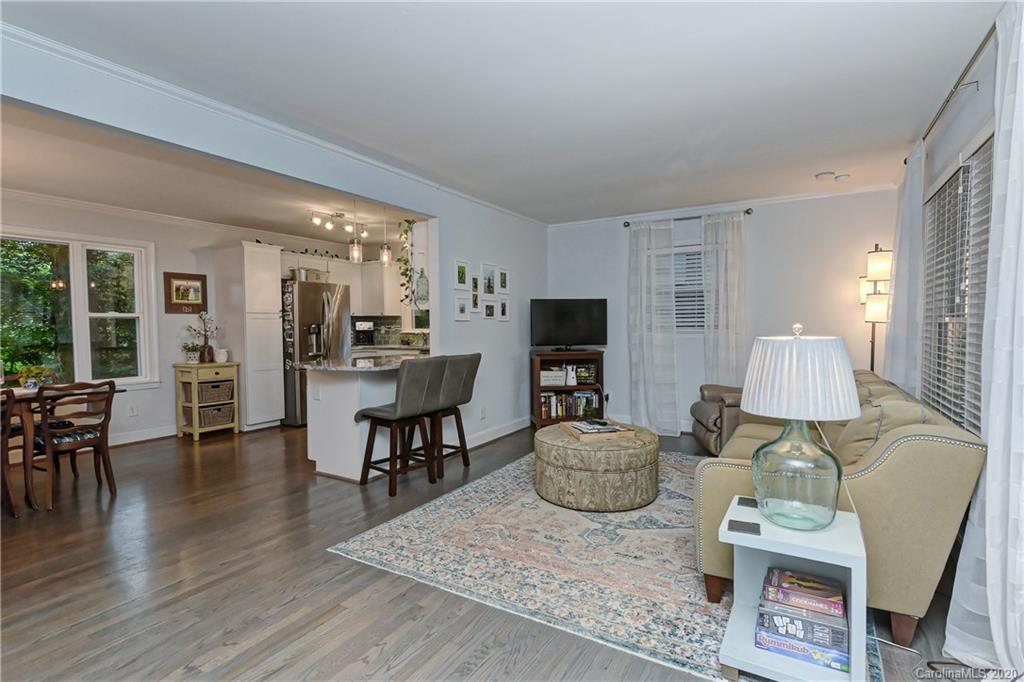 7407 Watercrest Road Charlotte, NC 28210 - Photo 5 of 42 a living room with furniture and a wooden floor