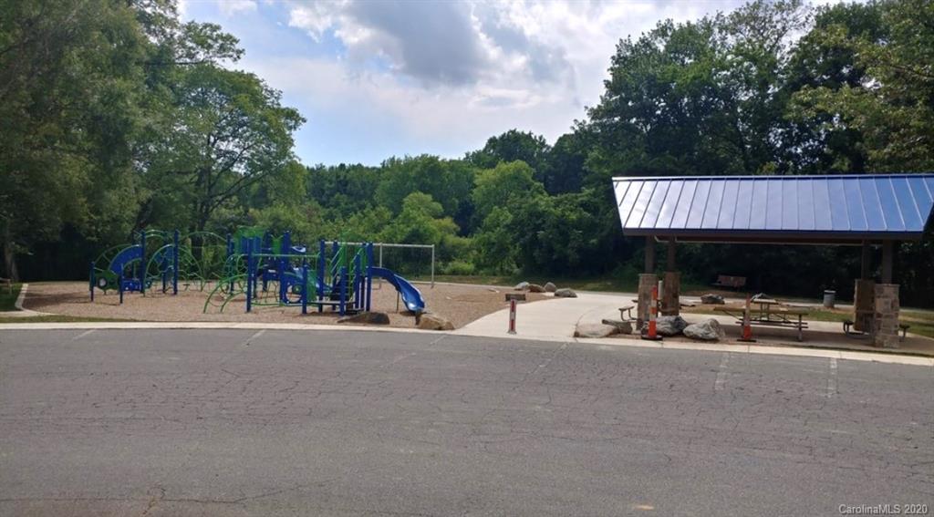 7407 Watercrest Road Charlotte, NC 28210 - Photo 42 of 42 a view of a park with swings and slides