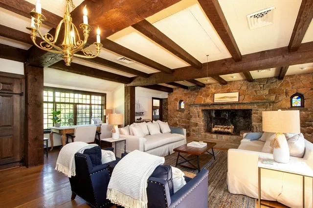 a living room with furniture a ceiling fan and a rug