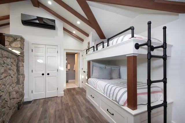 a spacious bathroom with a granite countertop sink mirror and shower