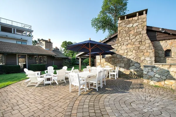 a patio with a yard table and chairs