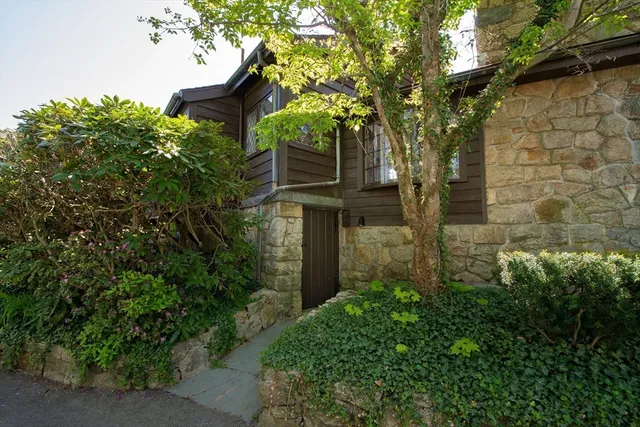 a front view of a house with garden