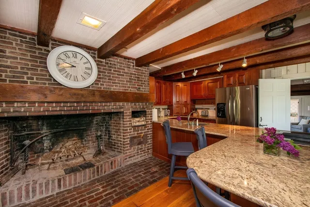 a dining room with furniture and wooden floor