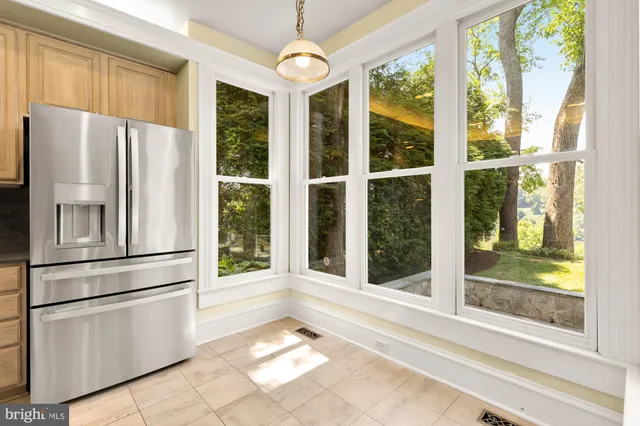 a white refrigerator freezer and a window