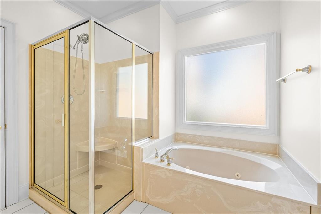 1030 Lakeview Parkway Villa Rica, GA 30180 - Photo 14 of 46 a bathroom with a bathtub and a shower