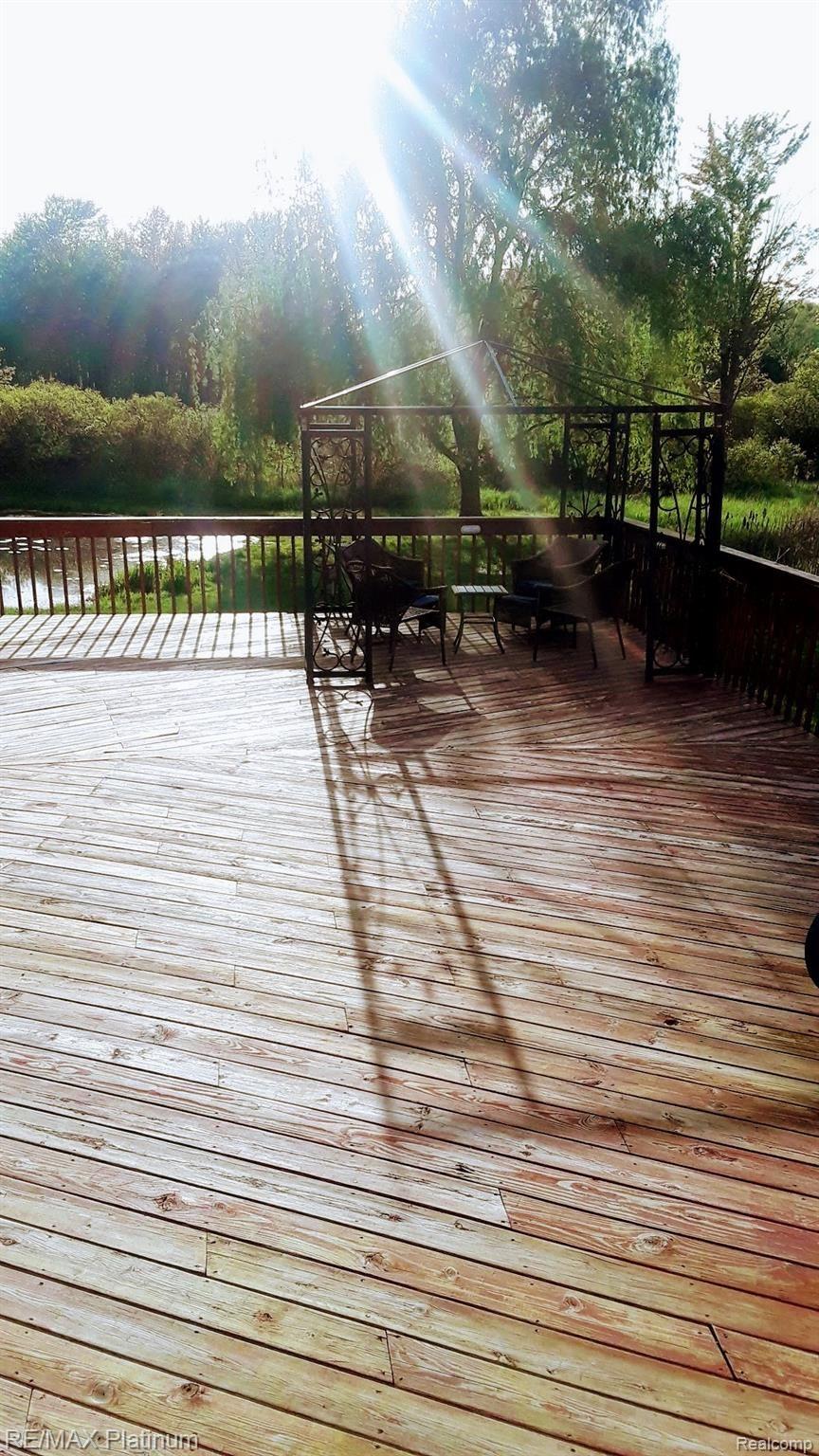 4052 Cedar Lake Road Howell, MI 48843 - Photo 27 of 34 Massive deck overlooking pond