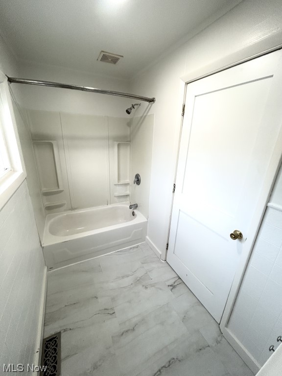 57 South Seneca Street Rittman, OH 44270 - Photo 13 of 26 Bathroom featuring tile floors and tub / shower combination